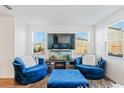 Cozy living room featuring bright windows, comfortable seating and stylish decor at 579 Magnolia Cir, Palmetto, GA 30268