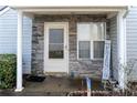 Inviting front porch with stone facade, offering a cozy and stylish entrance to the home at 11 Montclair Ct, Cartersville, GA 30121