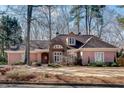 Beautiful single-story home featuring a manicured lawn and multiple windows at 1865 Berkeley Mews Ne, Atlanta, GA 30329