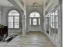 Grand foyer featuring soaring ceilings, arched windows, elegant flooring, and natural light at 2860 Chardonnay Ln, Cumming, GA 30041