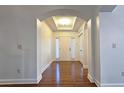 Inviting foyer with hardwood floors and an arched ceiling and doorway at 6515 Bentley Ridge Dr, Cumming, GA 30040