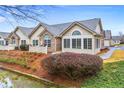 A view of the building's side, with a nice yard, and manicured shrubs at 302 Silver Summit Se Dr, Conyers, GA 30094