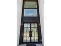 Close-up of a modern front door with a black frame and large windows at 1410 Lavista Ne Rd, Atlanta, GA 30324