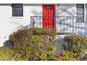 Close up of bright red front door of a white brick home at 1796 Arkose Se Dr, Atlanta, GA 30316