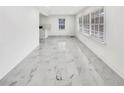 An open floorplan with lots of natural light through large windows illuminating modern flooring at 136 Victor Nw Cir, Atlanta, GA 30314