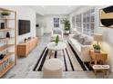 Bright living room featuring modern furnishings, sleek floors, and plenty of natural light at 136 Victor Nw Cir, Atlanta, GA 30314