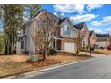 Lovely two-story home with a well-maintained lawn and mature trees in a quiet neighborhood at 3369 Arbor Path Drive Dr, Atlanta, GA 30340