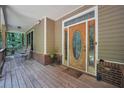 Inviting covered front porch with a decorative front door and classic rocking chairs at 718 Fincher Rd, Covington, GA 30016