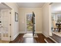 Inviting foyer with hardwood floors and views of the landscaped backyard through an open doorway at 2508 Brookwood Ne Dr, Atlanta, GA 30305