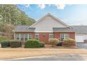 Charming single-story home with manicured landscaping, brick accents, and white siding at 4479 Caleb Xing, Powder Springs, GA 30127