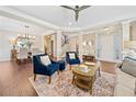 Elegant living room and dining area featuring hardwood floors, stylish furniture, and open layout at 3232 Cates Ne Ave, Brookhaven, GA 30319