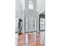 Welcoming foyer with hardwood floors, high ceilings, and a bright entry door at 907 Fox Croft Pl, Canton, GA 30114