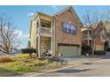 Charming two-story brick home featuring a front-entry garage and an inviting second story balcony at 1600 Yukon Ct, Atlanta, GA 30349