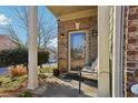 Inviting front porch features decorative columns, space for seating and a glass front door at 1600 Yukon Ct, Atlanta, GA 30349
