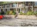 Attractive townhouse exteriors with stone accents, lush plantings and ample parking at 3200 Seven Pines Ct # 4, Atlanta, GA 30339