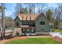 Beautiful two-story home with a manicured lawn, stone accents, and a welcoming facade at 1445 Ashwoody Ne Ct, Atlanta, GA 30319