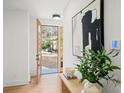 Bright entryway featuring hardwood floors, a modern door, and contemporary decor at 1788 Piper Se Cir, Atlanta, GA 30316