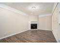 Cozy living room featuring a fireplace and neutral paint, complete with wood-look laminate floors at 1146 Canal St, Decatur, GA 30032