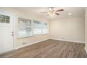Bright living room with natural light, laminate flooring, and modern ceiling fan at 1146 Canal St, Decatur, GA 30032