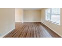 Bright living room with wood floors and a large window with blinds at 2202 Troutdale Dr, Decatur, GA 30032