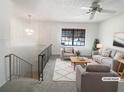 Staged living room with modern furniture, neutral tones, and ample natural light at 6742 Green Meadows Ln, Morrow, GA 30260