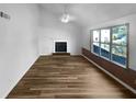 Inviting living room with wood floors, fireplace, and large windows at 3782 Westchase Dr, Marietta, GA 30066