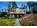 Rear view of the house, showing a spacious deck and walkout basement at 805 Wesley Oak Rd, Atlanta, GA 30328