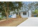 Charming renovated home with a well-maintained front yard and newly paved driveway at 3393 Phillip Cir, Decatur, GA 30032