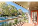 Scenic balcony view overlooking lush greenery and a refreshing community pool at 44 Finch Ne Trl, Atlanta, GA 30308