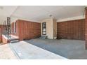 Spacious carport with a brick wall, offering sheltered parking and extra storage at 2837 Davidson Dr, Lithonia, GA 30058