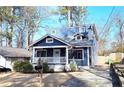 Inviting two-story home with a classic blue exterior, white trim, and a cozy front porch at 1659 Olympian Sw Way, Atlanta, GA 30310