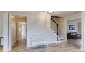 Inviting foyer with light wood floors, a staircase, and white trim at 1742 Dunridge Ct, Dunwoody, GA 30338