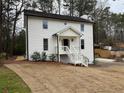 Beautifully renovated home with new landscaping and a pristine white facade at 3663 Heatherwood Ne Dr, Marietta, GA 30066