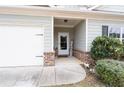 Inviting covered front porch with a 'welcome' sign and manicured bushes at 23 Ponders Se Rd, Cartersville, GA 30121