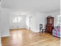 Bright and airy living room with hardwood floors and natural light from the windows at 3073 Henderson Mill Rd, Atlanta, GA 30341