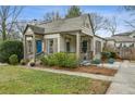 Charming home featuring a covered porch, well-maintained landscaping, and a cozy, inviting atmosphere at 49 Wyman Se St, Atlanta, GA 30317