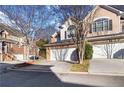 A well maintained townhome features a two-car garage and a neat driveway at 3263 Tomeh Way, Tucker, GA 30084