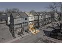 Attractive townhome row with colorful facades, covered balconies and sidewalks at 68 Adore Se Ct, Atlanta, GA 30315