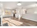 Open-concept living room with hardwood floors, large windows and ample natural light at 1534 Norman Xing, Atlanta, GA 30349