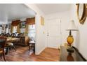 Inviting entryway featuring hardwood floors, a classic lamp, and direct access to the dining area at 3948 Bright Star Rd, Douglasville, GA 30135