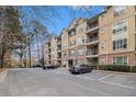 Multi-level condo building offers convenient parking and timeless elegance with its manicured landscaping at 2201 Stratford Commons, Decatur, GA 30033