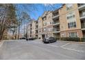 Multi-level condo building offers convenient parking and timeless elegance with its manicured landscaping at 2201 Stratford Commons, Decatur, GA 30033