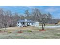 Lovely home with an attached two-car garage and well-maintained lawn at 2885 Green Rd, Loganville, GA 30052