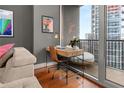 Office nook featuring a modern desk and chair with access to a private balcony at 1080 Peachtree Ne St # 2108, Atlanta, GA 30309