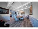 Elegant dining room with coffered ceilings, chandelier lighting, and decorative wall paneling at 149 Avalon Way, Sharpsburg, GA 30277