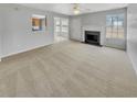 Spacious living room featuring neutral paint and carpet, with a fireplace at 3414 Bench Ave, Atlanta, GA 30349