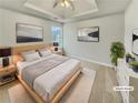 Serene main bedroom featuring a tray ceiling and staged decor at 3414 Bench Ave, Atlanta, GA 30349