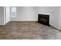 Spacious living room showcasing hardwood floors and a cozy fireplace at 61 Barrington Pl, Marietta, GA 30066