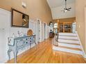 Spacious foyer with hardwood floors, staircase, and high ceilings, creating an inviting entrance at 3130 Kates Nw Way, Kennesaw, GA 30152
