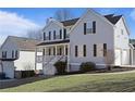 Two story home featuring well maintained lawn and three car garage at 4085 Amberly Nw Grn, Kennesaw, GA 30144